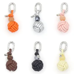 Set of 6 colorful handmade woven PU leather ball charms with silver metal clips for bags.