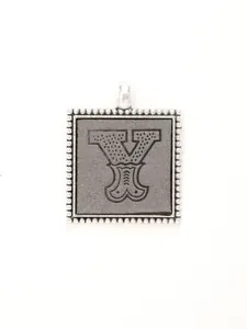 Close-up of retro silver alloy square pendant featuring engraved letter Y detail