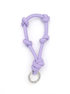 Close-up of purple knotted leather phone lanyard with a silver metal carabiner ring