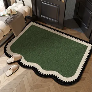 Elegante tappeto d'ingresso in velluto a ricci con motivo geometrico verde e bordo ondulato