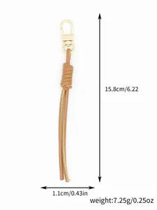 Detailed view of a hand-woven brown PU leather keychain with precise size annotations.