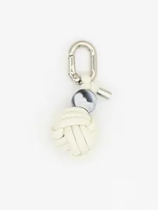 Detailed view of handmade white PU woven ball keychain charm with marble bead and silver clip