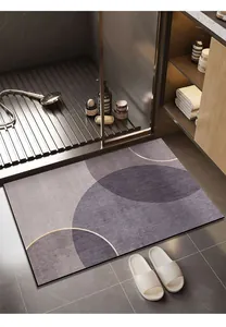 Modern geometric bathroom absorbent mat in purple and grey tones for a minimalist home.