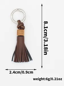 Handmade brown PU tassel keychain with wooden bead detail showing 8.1cm length