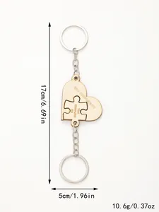 Wooden heart puzzle keychain set with 'You Complete Me' engraving and dimensions
