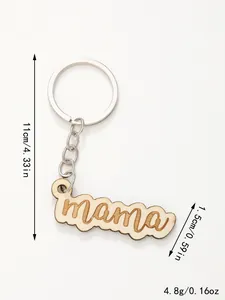 Close-up detail of wooden mama keychain showing laser-cut letters and exact size.