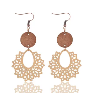Bohemian hollow cutout teardrop wood earrings featuring intricate vintage lace patterns