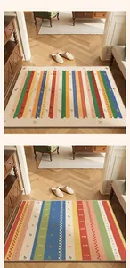 Close-up of two colorful striped TPR loop pile doormats featuring a non-slip backing