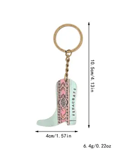 Detalle del llavero bota western con dimensiones precisas y peso para la talla.