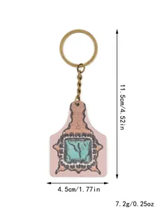 Western style cow ear tag keychain with dimensions 11.5x4.5cm and 7.2g weight details.