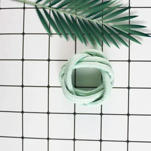 Detailed macro view of mint green PU stitched core cord for DIY bag weaving and crafts