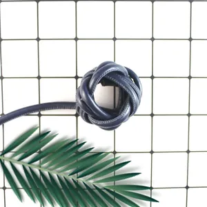 Macro detail of durable dark blue PU leather braided cord for DIY jewelry and crafts