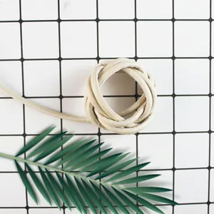 Detail shot of beige stitched PU leather piping cord for DIY jewelry and bag weaving