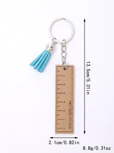 Custom wooden ruler keychain with blue tassel decoration showing 13.5cm length dimensions
