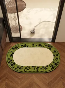 Top view detail of an oval floral diatom mud bath mat on premium wood flooring