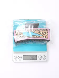 Detailed view of leopard print lightning bolt hair claw clip weighing 26.7 grams