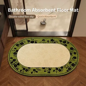 Oval quick-dry diatom mud bathroom mat with green floral border, non-slip.