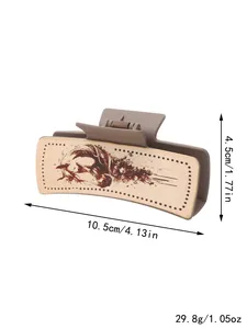 Détail d'une pince à cheveux avec imprimé cheval style western et dimensions 10,5x4,5cm
