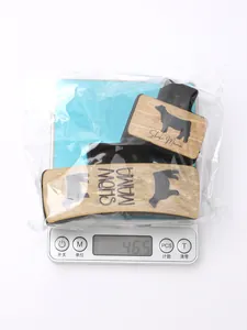 Western style cow pattern hair claw clips set showing product weight on an electronic scale