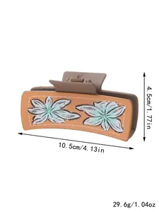 Close-up of a western style floral hair claw clip with dimension and weight specs