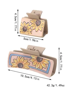 Detailweergave met afmetingen van de zonnebloem lederen haarklemmen in twee maten