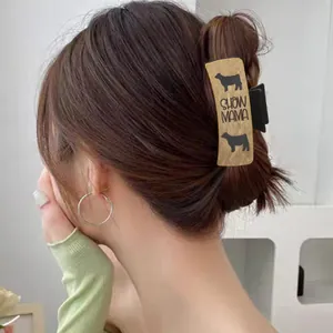Western style hair claw clip set with SHOW MAMA cow print leather design