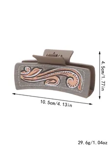 Macro view of Western-style hair claw clip with dimension and weight labels included