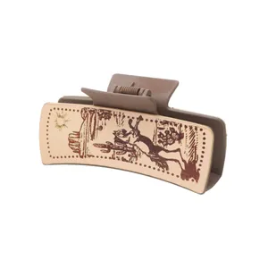 Pince à cheveux marron style western avec empiècement en cuir imprimé cactus du désert
