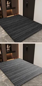Detail view of luxurious striped loop velvet entrance mats in dark and light grey