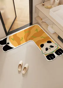 Detail of cute L-shaped panda cartoon floor mat placed at the bathroom corner doorway