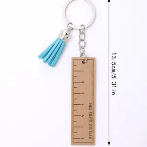 Creative wooden ruler keychain featuring a blue tassel and Mrs. Silzer You Rule engraving
