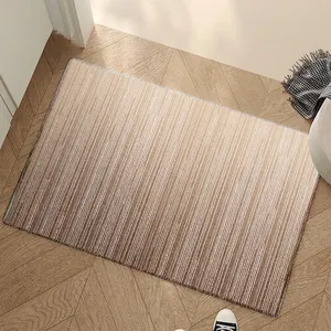 Modern gradient brown striped loop velvet entrance doormat on wooden floor