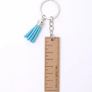 Personalized wooden ruler keychain with blue leather tassel and engraved thank you message