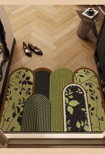 Detailed view of a mid-century modern green entrance mat with elegant leaf patterns and arches.