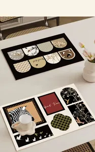 Close-up detail of vintage style leather placemats featuring bird and zebra designs