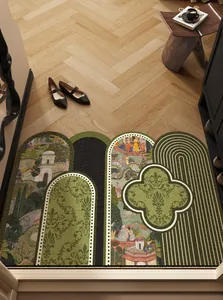 Detailed view of a vintage green entrance mat with arch designs on a wooden floor