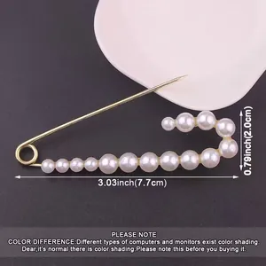 Dimensions of the gold metal pearl safety pin brooch shown for waist adjustment use
