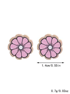 Close-up detail of pink wooden sunflower stud earrings with 1.4cm size annotation