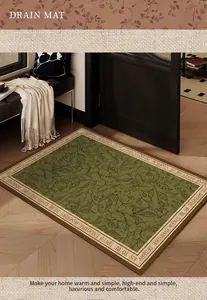 Detailansicht der grünen Diatomeenschlamm-Türmatte mit floralen Mustern und Textrand.
