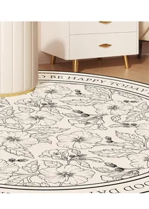 Dettaglio del tappeto rotondo crema a fiori con testo Be Happy Today per camera letto