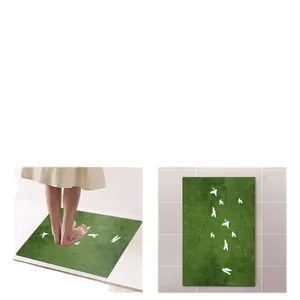 Soft absorbent green diatomaceous earth bath mat with cute white bird pattern graphics