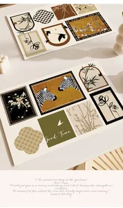 Close-up of vintage French style leather placemats with zebra and floral patterns
