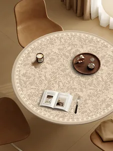 Detailed view of an elegant French floral round PVC leather waterproof table mat