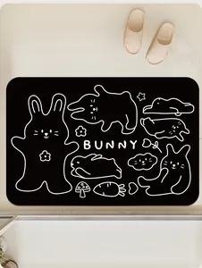 Vista superior de una alfombrilla de baño negra con bonitos dibujos de conejitos