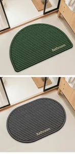 Detalle de alfombras de baño de tierra de diatomeas semicirculares y óvalos en dos colores