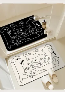 Vista detallada de alfombras de baño absorbentes blancas y negras con dibujos de perros