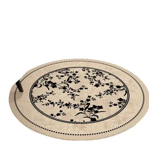 Vintage French style round living room rug with elegant black floral pattern on beige