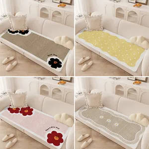 Cream style non-slip sofa mats with floral and polka dot patterns for living room decor