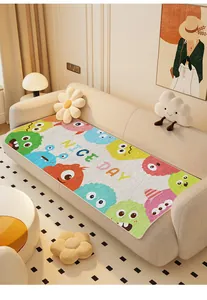 Detailweergave van schattig cartoon bankkussen met kleurrijke monsters en vrolijke tekst