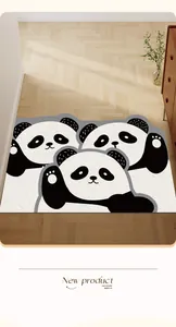 Détails du motif de panda mignon sur la surface texturée du tapis d'entrée antidérapant